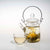 Teaposy falling water tea blooming in the tea for one glass teapot, with a soul-mates glass cup and saucer set