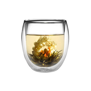 Teaposy rondo double-walled glass tea mug holding a lady fairy blooming tea inside