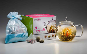 Teaposy lady fairy blooming tea showing in the celebrate glass teapot, along with a pretty gift box